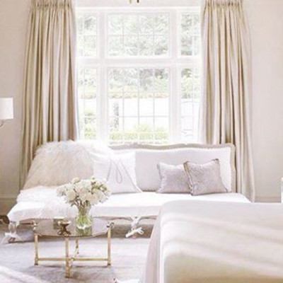 Cream and white colored bedroom